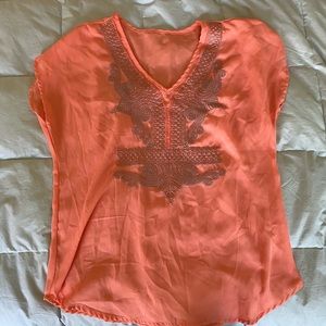 orange flowy shirt